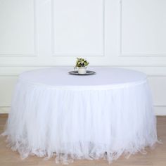 [About] Quantity: 1 Table Skirt Materials Table Skirt: Tulle Lining: Cotton Color: White Size: 17ft wide x 29" tall No. of Tulle Layers: 4 Top Satin Width: 2" All table skirts come with 1" velcro on top for attachment to clips. (Clips are sold separately) Tablecloth and decorations are not included. [Information] Additional Information: Material: Cotton Lining With Tulle Strips Measurements: 17ft wide x 29" tall Top Satin Width: 2" How to Care: Hand wash only. Hang dry, don't use dryer. Total 4 Pleated Table Skirt, Tutu Table Skirt, Tutu En Tulle, Tutu Table, Tulle Table Skirt, Tulle Table, Table Skirts, Top Satin, Skirt Elegant