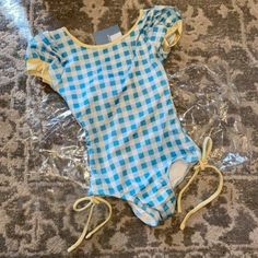 Wdw Wilding Blue Checkered One Piece Bathing Suit. New With Tags. Size 12 Months. Summer Swimwear With Short Sleeves For Playtime, Short Sleeve Cotton Swimwear For Play, Fitted Cotton Playful Swimwear, Playful Fitted Cotton Swimwear, Playful Light Blue Swimwear For Spring, Playful Short Sleeve Swimwear For Spring, Playful Light Blue Fitted Swimwear, Playful Fitted Light Blue Swimwear, Fitted Gingham Playful Swimwear