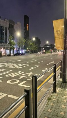 an empty city street at night with no traffic