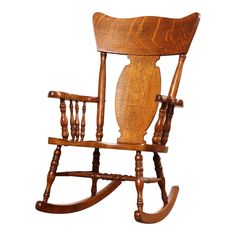 a wooden rocking chair with an owl on it's back legs and footrests