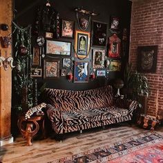 a living room filled with furniture and pictures on the wall