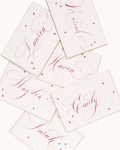 four cards with red ink on them and the words love written in cursive writing