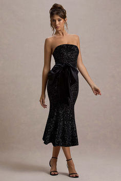 Party season calls for a statement piece like Adee. Expertly crafted in a shimmering sequinned velvet, this black midi dress is further enhanced by a self-tie halter neckline, large oversized bow and flattering flared hemline. Keep Adee at the forefront of your next soiree and style yours with a simple sleek bun and strappy stilettos.

Features
- Premium sequin velvet
- Halter neckline
- Self-tie straps
- Invisible zip closure
- Oversized bow detail
- Flared hemline
- Midi length 

Sizing & Fit
Model is 5'7 and wears UK size 8 / US size 4

Product Information
Designed exclusively by Artabri
Lined / good stretch 
Premium velvet in Black (92% Polyester, 8% Elastane) 
Premium sequin in Black (100% Polyester)
125cm total length 
SKU: CL135383002 Night Time Outfits, Fishtail Maxi Dress, Cocktail Dress Formal, Sleek Bun, Corsets And Bustiers