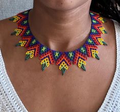 Punta corazón | Handmade necklace by Embera Chamí communities from Colombia | Fair trade Handmade Necklace, Beaded Necklaces, Chain Styles, Artist At Work, Fair Trade, Minneapolis, Handmade Necklaces, Bead Work, Beaded Necklace