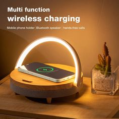 an image of a cell phone charging on a table with the text multi function wireless charging