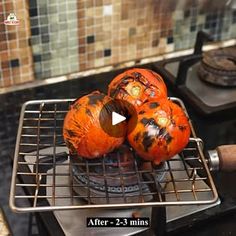 some oranges are sitting on top of a burner