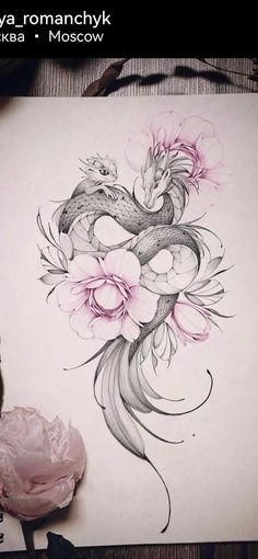 a drawing of a dragon and flowers on paper