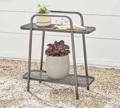 a potted plant sitting on top of a metal stand