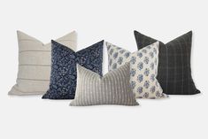 four pillows in different colors and patterns