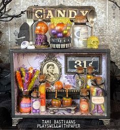 an old fashioned halloween display with candy and candies