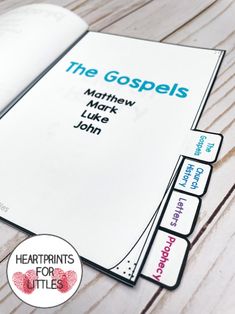 an open book with the words, the gospels and mark luke john on it