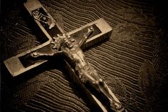 the crucifix is shown in black and white, with a cross on it