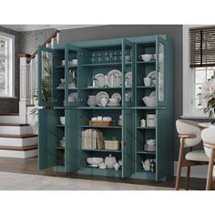 a blue bookcase with dishes and plates on it