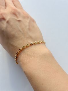 Compliment your bracelet stack with this dainty mariner style bracelet! Made with 18K 1/30 gold-filled chain, this is a bracelet that's easily stacked, or worn on its own. 18K 1/30 gold-filled bracelet 7 in. length chain Care instructions: With the proper care, gold-filled jewelry can last a very long time! Here are some handy tips for making sure that your jewelry shines as long as possible: While waterproof, remove your jewelry before swimming or hot tubs. Keep your jewelry away from lotion, p Dainty Gold-plated Oyster Bracelet, Dainty Gold Plated Oyster Bracelet, Dainty Gold Chain Bracelet With Oyster Style, Everyday Gold Plated Oyster Bracelet, Dainty Stackable 14k Gold Filled Chain Bracelet, Everyday Gold-plated Oyster Bracelet, Tarnish Resistant Oval Link Dainty Bracelet, Tarnish Resistant Dainty Oval Link Bracelets, Dainty Oyster Bangle Chain Bracelet