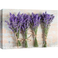 three bundles of lavender flowers tied with twine