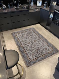 a large rug in the middle of a kitchen