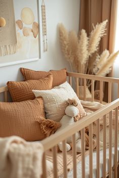 a crib with pillows and stuffed animals in it