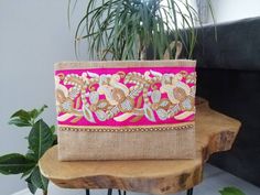 This floral clutch will bring elegance to your style. It will be chic with jeans or dresses and you may use this boho bag both day and night. This clutch wallet is perfectly handmade with high quality natural jute fabric. Designed with a silk bohemian embroidery and a tassel. Clutch has a pink silk satin interfacing and a padding inside to stand upright. Closes with a magnet closing. This bag is designed to fit all the things you need for comfortable everyday busy life. There will be enough spac Chic Handmade Clutch, Beige Clutch Evening Bag For Festive Occasions, Festive Beige Evening Clutch, Handmade Chic Clutch, Chic Handmade Beige Clutch, Handmade Chic Clutch Evening Bag, Chic Handmade Clutch Evening Bag, Chic Rectangular Clutch As Gift, Chic Rectangular Clutch As A Gift