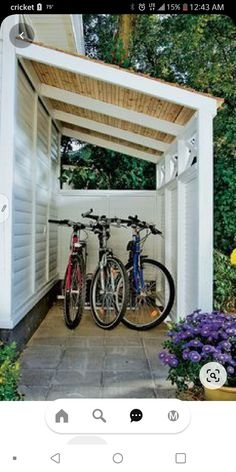 two bikes are parked under a pergolated area