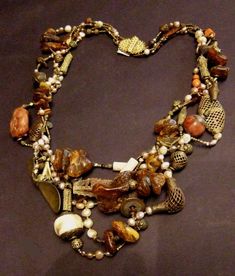 Extravagant multi-strand necklace; large amber chunks, coral, pearls, old brass pieces, silver capped conch and more surprises. 34 Bellingham Wa, Metal Bead, Ethnic Necklaces, Beading Ideas, Handmade Fashion Jewelry, Adjustable Necklace, Multi Strand Necklace, Shell Beads, Etsy Jewelry