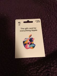 an apple gift card sitting on top of a purple blanket with the words, the gift card for everything apple