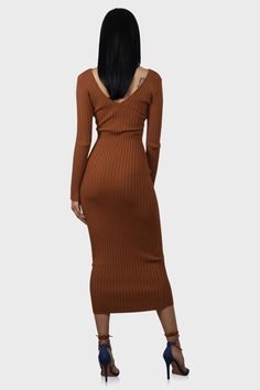 This midi sweater dress is anything but basic! Features a v-neck and ribbed knit with plenty of stretch. Complete the look with your favorite leather jacket. Color: Rust Model wearing size Small Size S measures 53" from center back to hem Runs true to size Fabric has stretch 70% Rayon /30% Nylon Hand wash cold Ribbed V-neck Sweater Dress For Date Night, Brown Ribbed V-neck Dress, Brown Ribbed Stretch Sweater Dress, Brown Stretch Ribbed Sweater Dress, Stretch Ribbed Brown Sweater Dress, Long Ribbed Sweater Dress For Fall, Brown Ribbed Midi Sweater Dress, Fall Stretch Sweater Dress Midi Length, V-neck Ribbed Sweater Dress For Night Out