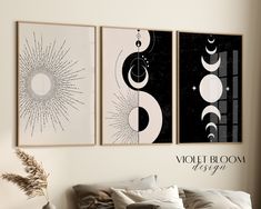 two black and white art prints hanging on the wall above a bed in a bedroom