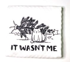 a tea towel with a cat on it that says, it was't me