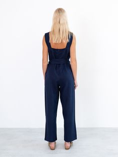 "DAKOTA is a sleeveless jumpsuit with belt. DETAILS - Tank style top - Sleeveless design - Zip closure at the back - Self tie belt - 100% midweight European linen fabric - Cut and sewn to order just for you in our studio COLOR - Navy Blue, you can also choose other colors above - Fabric samples are available here https://www.etsy.com/listing/586569696/linen-fabric-samples SIZING & FIT - Fits true to size - Inseam is approximately 27 inches / length 68.5 cm - Bust is approximately 21 inches / Chic Sleeveless Jumpsuits And Rompers With Tie Waist, Casual Sleeveless Belted Jumpsuits And Rompers, Belted Strapless Jumpsuit For Workwear, Sleeveless Denim Jumpsuit For Summer Workwear, Elegant Sleeveless Linen Jumpsuit, Chic Denim Jumpsuit With Belt Loops, Belted Strapless Sleeveless Jumpsuit, Belted Strapless Jumpsuit, Blue Belted Jumpsuit For Summer