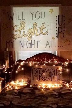 a bed with lights on it and the words will you light up my night at prom?