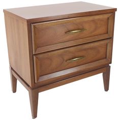 a wooden dresser with two drawers on it