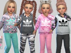 three girls wearing adidas sweatshirts and leggings with their hair in pigtails