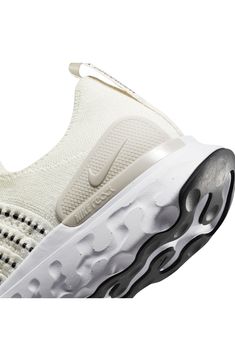 Breathable and lightweight, this sock-fit running shoe pairs a flexible, supportive Flyknit upper with an energy-returning Nike React foam sole. Molded heel plates and targeted rubber in the tread help deliver distraction-free comfort and traction through every stride from heel strike to toe-off. Cushioning: absorbs impact and distributes weight for consistent, buoyant comfort under each step Lightweight: puts cushioning and performance underfoot with an emphasis on streamlined comfort Lightweig Lightweight Running Shoes With Branded Insole For Sports, Nike White Running Shoes For Outdoor, Sporty Lightweight White Running Shoes, Sporty White Lightweight Running Shoes, Lightweight Breathable White Running Shoes, White Lightweight Breathable Running Shoes, Lightweight Slip-resistant Running Shoes, Nike Comfortable Breathable Running Shoes, White Textile Running Shoes With Cushioned Footbed