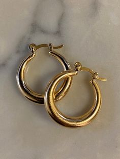 14kt gold-filled hollow hoop with leaver back. Measures 1.10" Classic Gold-tone Huggie Jewelry, 14k Gold Stamped Hoop Jewelry, Classic 14k Stamped Hoop Earrings, Nickel-free 14k Gold Hoop Jewelry, Everyday Small Hoop Hinged Earrings, Everyday Small Hoop Hinged Jewelry, Classic Small Hoop Earrings In 14k Gold Filled, Classic Hinged 14k Gold Hoop Earrings, Classic Jewelry With Gold Clasp