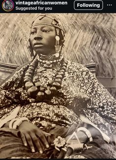 an old photo of a woman sitting in front of a wall with the caption, vintage african women suggest for you following