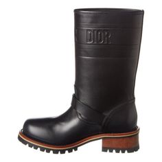 These mid-calf boots, featured in leather, are embellished with a debossed 'Christian Dior' signature representing the Dior Book Tote.The style is complete with a sturdy notched sole and belted strap detail.Upper: Matte Leather; Sole: RubberRound toeLug solePull-onMade in Italy Luxury Mid-calf Boots With Leather Sole, Luxury Mid-calf Boots In Calf Leather, Luxury Mid-calf Boots With Leather Sole And Snip Toe, Luxury Brown Calf Leather Mid-calf Boots, Luxury Black Mid-calf Boots With Leather Sole, The Bronx New York, Leather Jewels, Mid Calf Boots, Sierra Leone