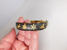 "Very nice Japanese Damascene bracelet. I believe made in Japan due to the bats  engraved on it. The older ones are made with silver and gold wire. This one has the gold wire. It is  2 3/8\" by 2 1/4\" on the inside and 1/2\" wide. It measures about 8\" on outside ." Safety Chain, Wire Bracelet, Old Ones, Rhinestone Brooches, Gold Wire, Silver And Gold, Made In Japan, Bangle Bracelets, Jewelry Bracelets