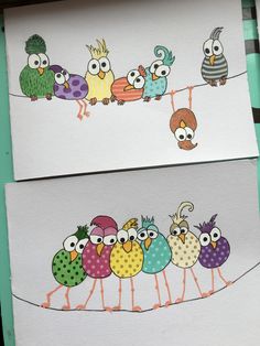 three different colored birds on white paper