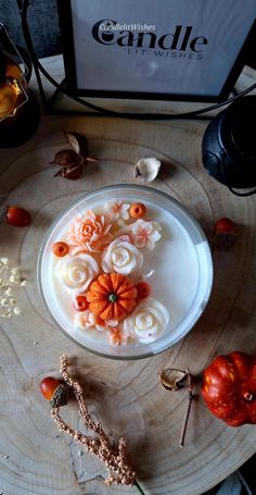 an arrangement of flowers in a bowl on a table