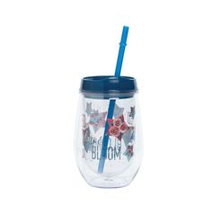 the tumbler cup has a straw in it and is decorated with red, white and blue stars