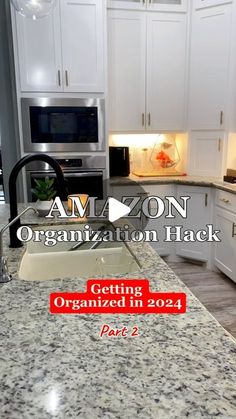 a kitchen with white cabinets and granite counter tops