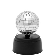 a disco ball sitting on top of a black base