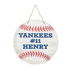 a wooden sign that says yankees 11 henry with a baseball in the middle of it