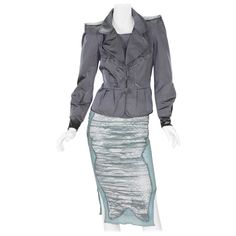 Tom Ford for Yves Saint Laurent Silk Pagoda Jacket with Skirt. French size 38 - US 6 Who could ever forget Tom Ford's final show for Yves Saint Laurent, his exquisite YSL Rive Gauche Chinoiserie collection, back in 2004. F/W 2004 Runway Collection - Ready to Wear Jacket size Fr. 38 - Gray Color Silk, Pagoda Style Shoulders with Epaulets, Two Front Pockets, Fully Lined, Button Closure, Peplum Waistline. Measurements: Length - 21.5 inches, Bust - 34 inches, Waist - 28/29 inches. Skirt size Fr. 38 Jacket With Skirt, Ysl Rive Gauche, Evening Suit, Silk Cocktail Dress, Black Tuxedo, Brown Skirts, Suits For Sale, Velvet Skirt, Rive Gauche