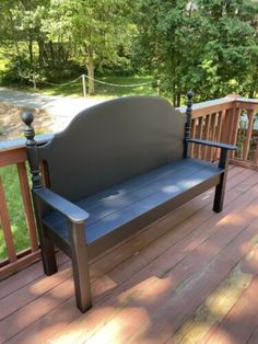 a bench sitting on top of a wooden deck