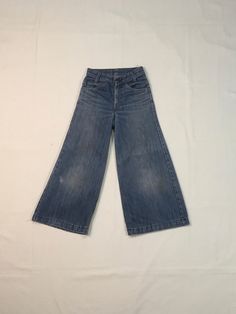 "1970s Levis bell bottom jeans made in USA orange tab SCOVILL zipper fly hemmed authentic age wear fade, fray, faded stains labeled 25 x 32, smaller/shorter, see below measures, lying flat, waist-12\" rise-10\" inseam-23 1/2\" hem-12\" hip-17 1/2\" out seam-33\" about 2\" could be added to length if unhemmed" Retro Full-length Light Wash Flare Jeans, Vintage Style Light Wash Flare Jeans, Retro Light Wash Full Length Jeans, Faded Vintage Wide-leg Bottoms, Retro Flare Jeans In Medium Wash, Retro Medium Wash Full Length Flare Jeans, Retro Full Length Medium Wash Flare Jeans, Vintage Blue Denim Flare Jeans, Vintage Light Wash Wide Leg Flare Jeans