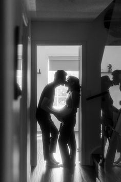 Couple stands in a doorway, directly in front of a window. They kiss as they both hold Sam's pregnant belly. A mirror on the right reflects them. The sunlight creates a glowing quality. Home Maternity Photos, Portraits At Home, Indoor Maternity Photos, Lifestyle Maternity Photography, Home Maternity Photography, Diy Maternity Photos, Maternity Studio Photoshoot, Family Lifestyle Photography, Pregnancy Announcement Photoshoot