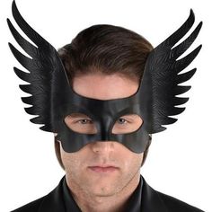 Top off your Halloween costume with this winged eye mask. It features faux leather wings on either side that are debossed with a feather pattern. Adjustable Black Eye Mask Costume Accessory, Wing Mask Masquerade, Gothic Eye Mask For Costume, Feathered Eye Mask For Masquerade Costume, Gothic Leather Masks For Costumes, Winged Eye, Wedding Balloon Decorations, Half Mask, Best Masks