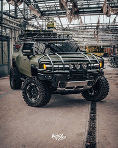 an off - road vehicle is parked in a warehouse