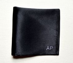 Personalized Pocket squares for men Black silk/satin fabric Information: 12x12 inches square Satin fabric Hemmed and machine stitched White monogram, font number 4. pictured Monogram: Please leave the initials for the monogram and font by number. **You may customize the pocket square request a custom order and let us know what you want us to make for you. **PLACEMENT INFORMATION** *Please note that some of our designs are not meant to be shown when placed in the pocket. If you want the initials Monogrammed Pocket Square, Man Gifts, Font Number, Silk Satin Fabric, Silk Pocket Square, Silk Accessories, Star Embroidery, Number 4, Pocket Squares